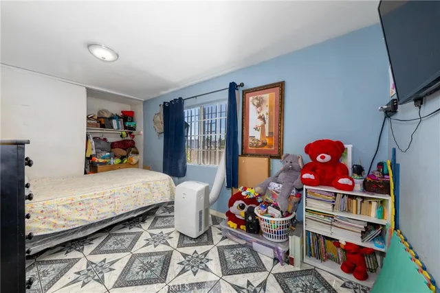 a room with toys and dresser