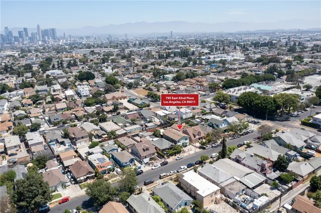 an aerial view of a city with lots of residential buildings