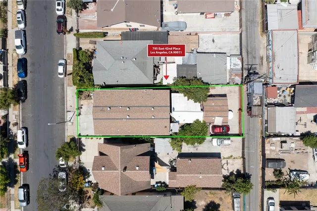 an aerial view of residential houses with outdoor space