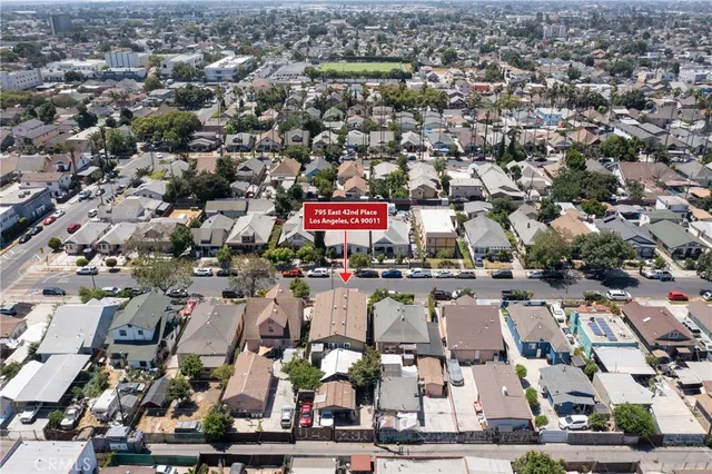 an aerial view of a city with lots of residential buildings