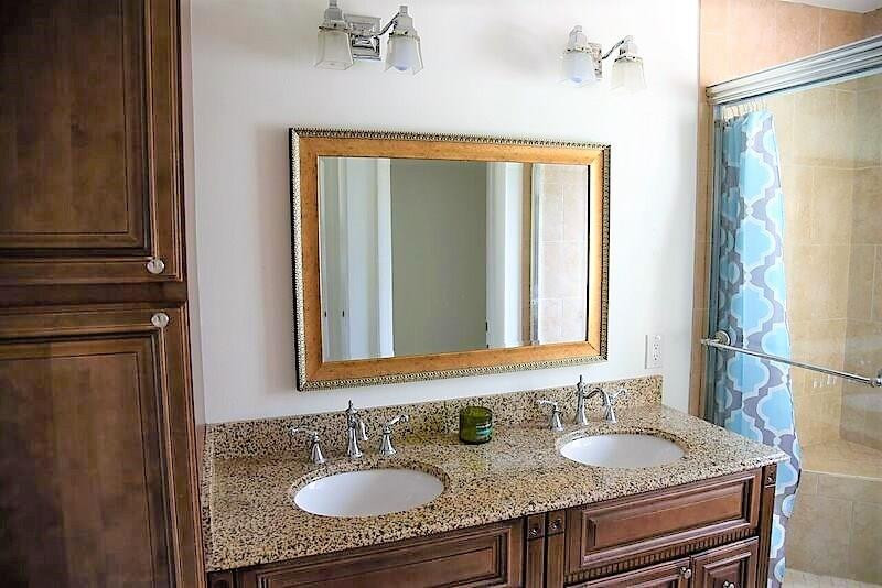 552 Talavera Road Weston, FL 33326 - Photo 11 of 16 a bathroom with a granite countertop sink and a mirror