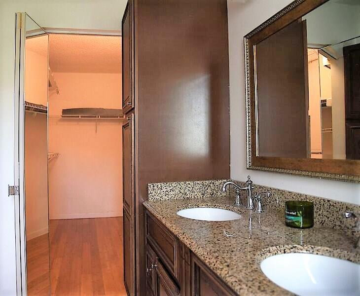 552 Talavera Road Weston, FL 33326 - Photo 12 of 16 a bathroom with a granite countertop sink and a mirror