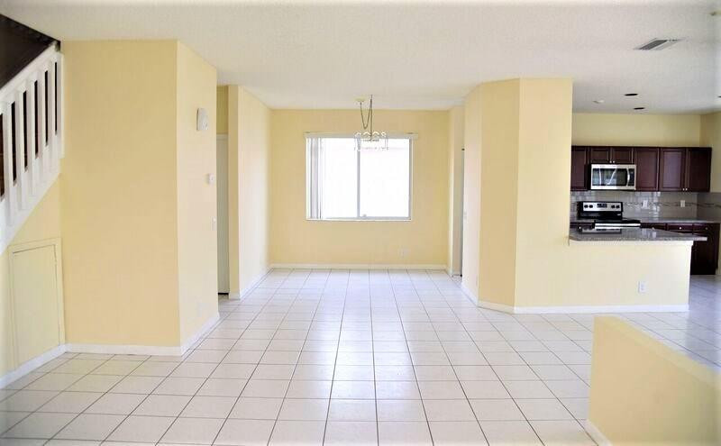 552 Talavera Road Weston, FL 33326 - Photo 6 of 16 a view of a kitchen with an empty space and a window