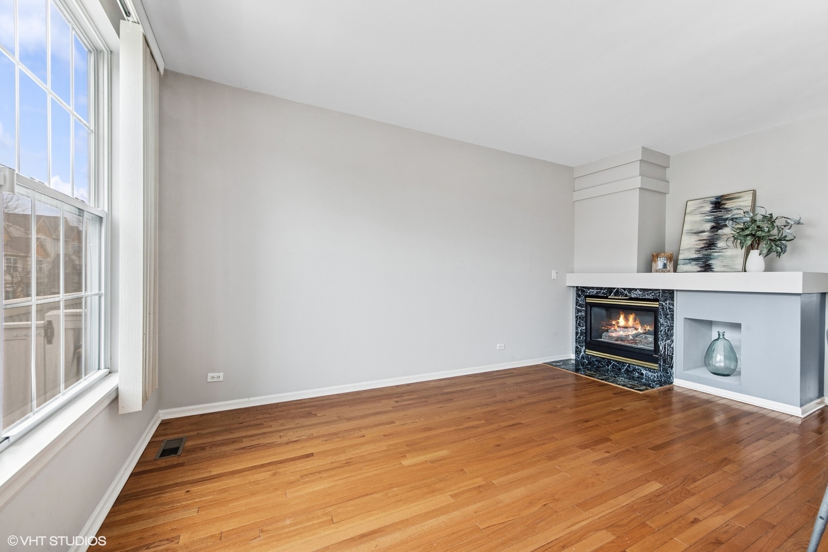 1136 Georgetown Way Vernon Hills, IL 60061 - Photo 11 of 21 wooden floor in an empty room with a window