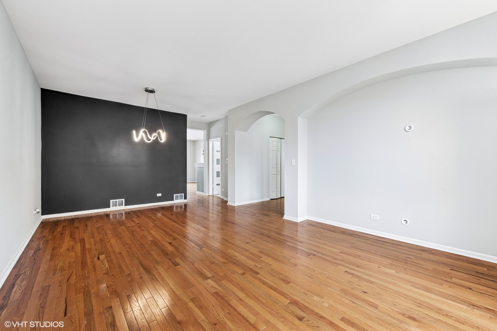 1136 Georgetown Way Vernon Hills, IL 60061 - Photo 5 of 21 a view of an empty room with wooden floor