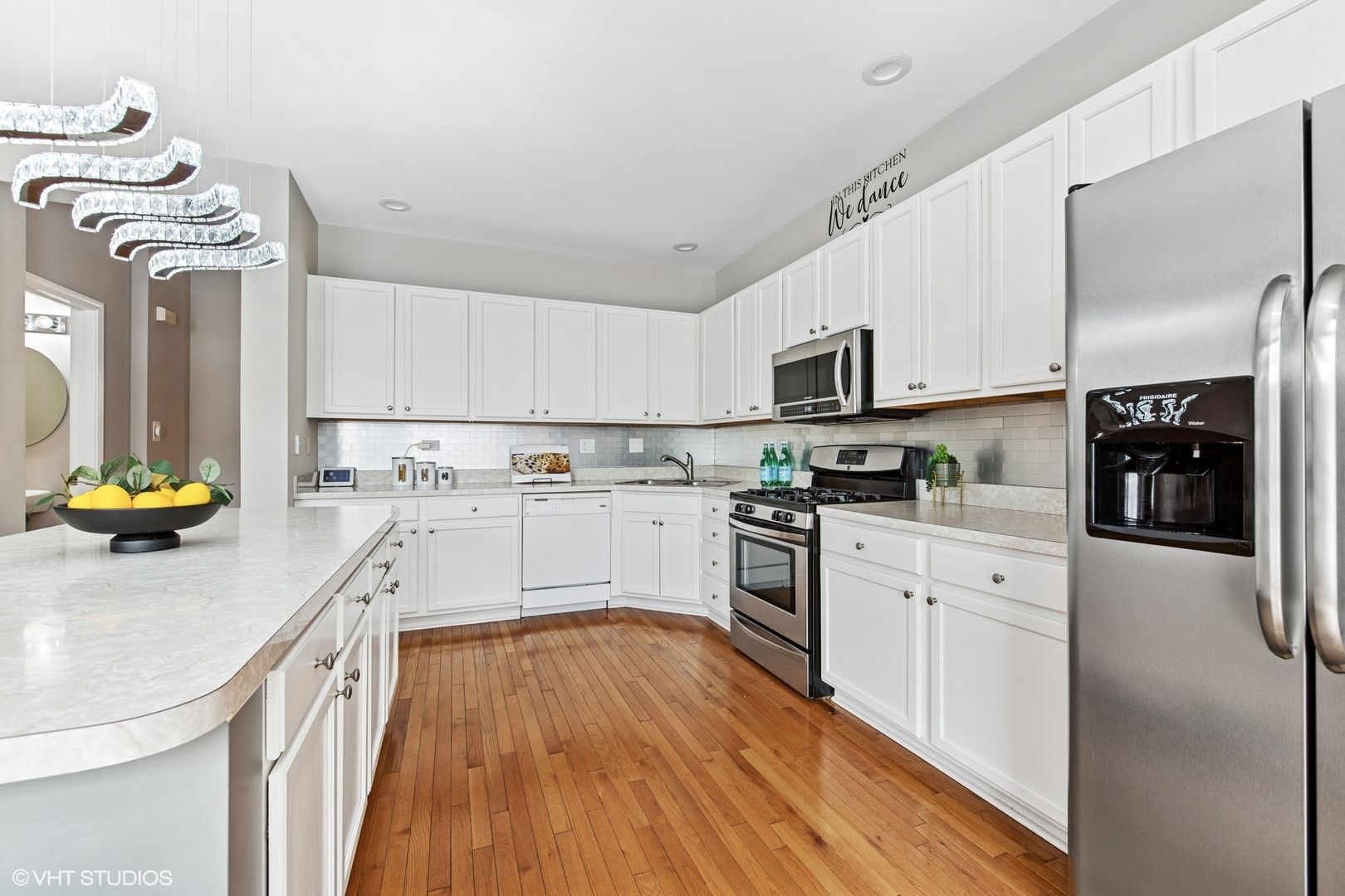 1136 Georgetown Way Vernon Hills, IL 60061 - Photo 8 of 21 a kitchen with white cabinets and appliances