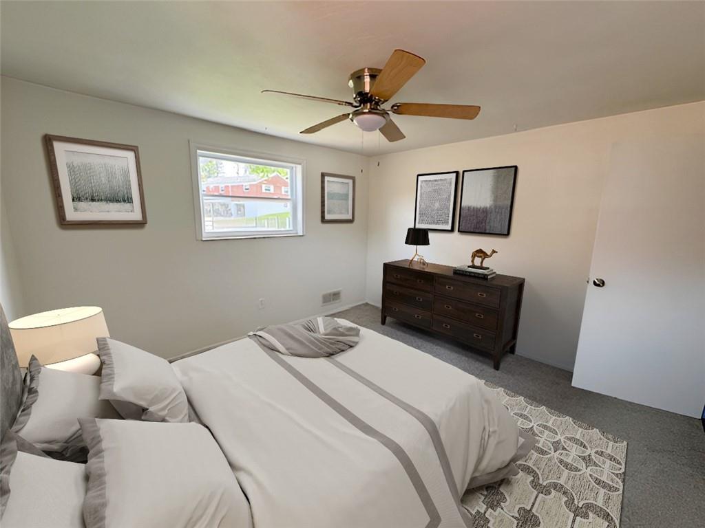 279 Olympic Road Pittsburgh, PA 15236 - Photo 16 of 25 a bedroom with a bed and a tv