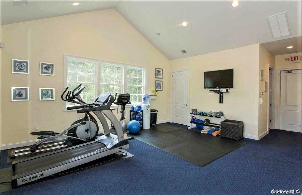 20 Canoe Place Road, Unit 8 Hampton Bays, NY 11946 - Photo 17 of 18 a view of a room with gym equipment