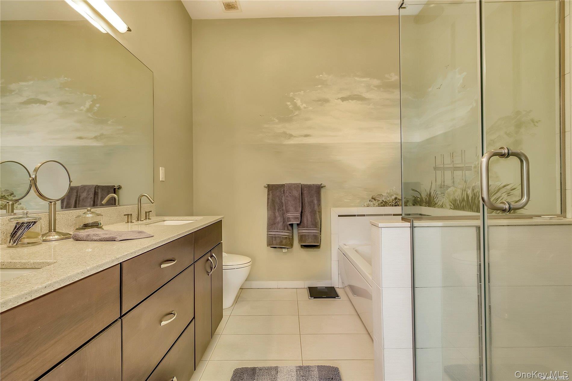 20 Canoe Place Road, Unit 8 Hampton Bays, NY 11946 - Photo 10 of 18 a bathroom with a double vanity sink a mirror and a shower