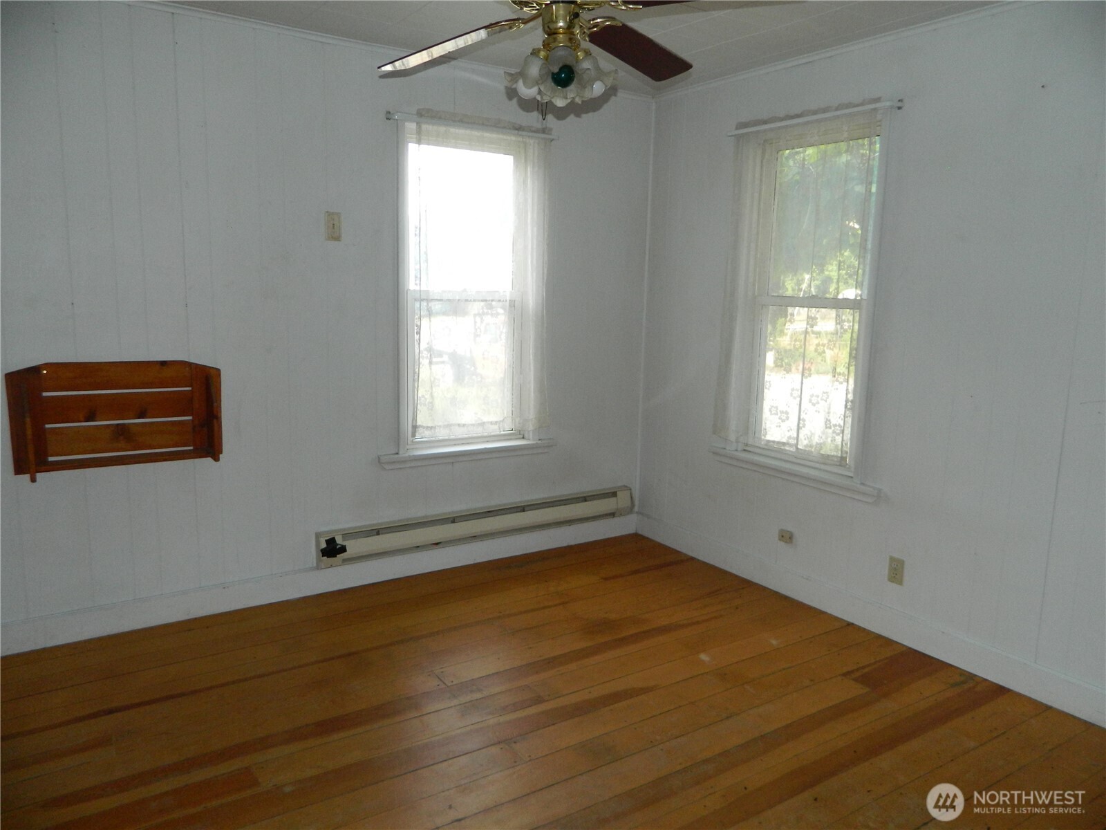 26 Palmer Avenue Loomis, WA 98827 - Photo 14 of 20 a view of empty room with window and wooden floor