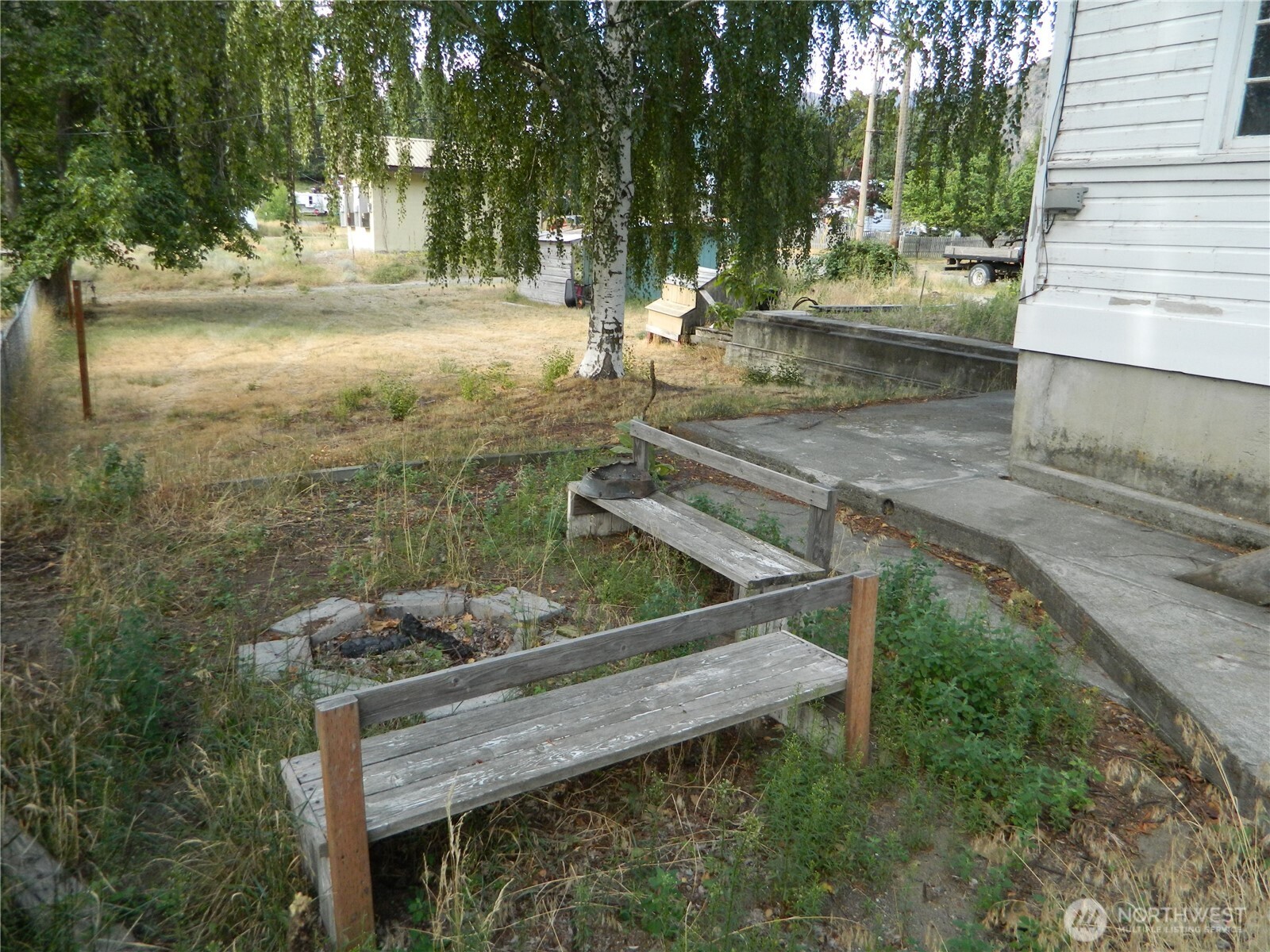 26 Palmer Avenue Loomis, WA 98827 - Photo 4 of 20 a view of a wooden deck and a yard
