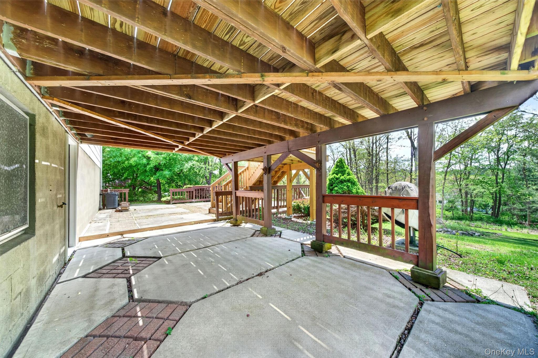 155 Pine Tree Road Monroe, NY 10950 - Photo 41 of 49 a patio with glass top table and chairs