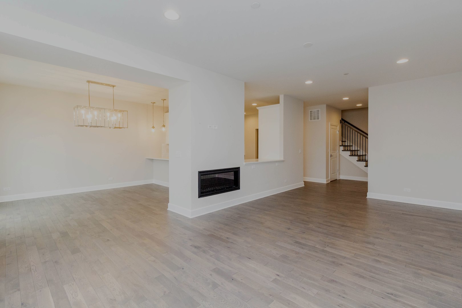 10723 Clock Tower Drive Countryside, IL 60525 - Photo 3 of 31 an empty room with wooden floor and windows