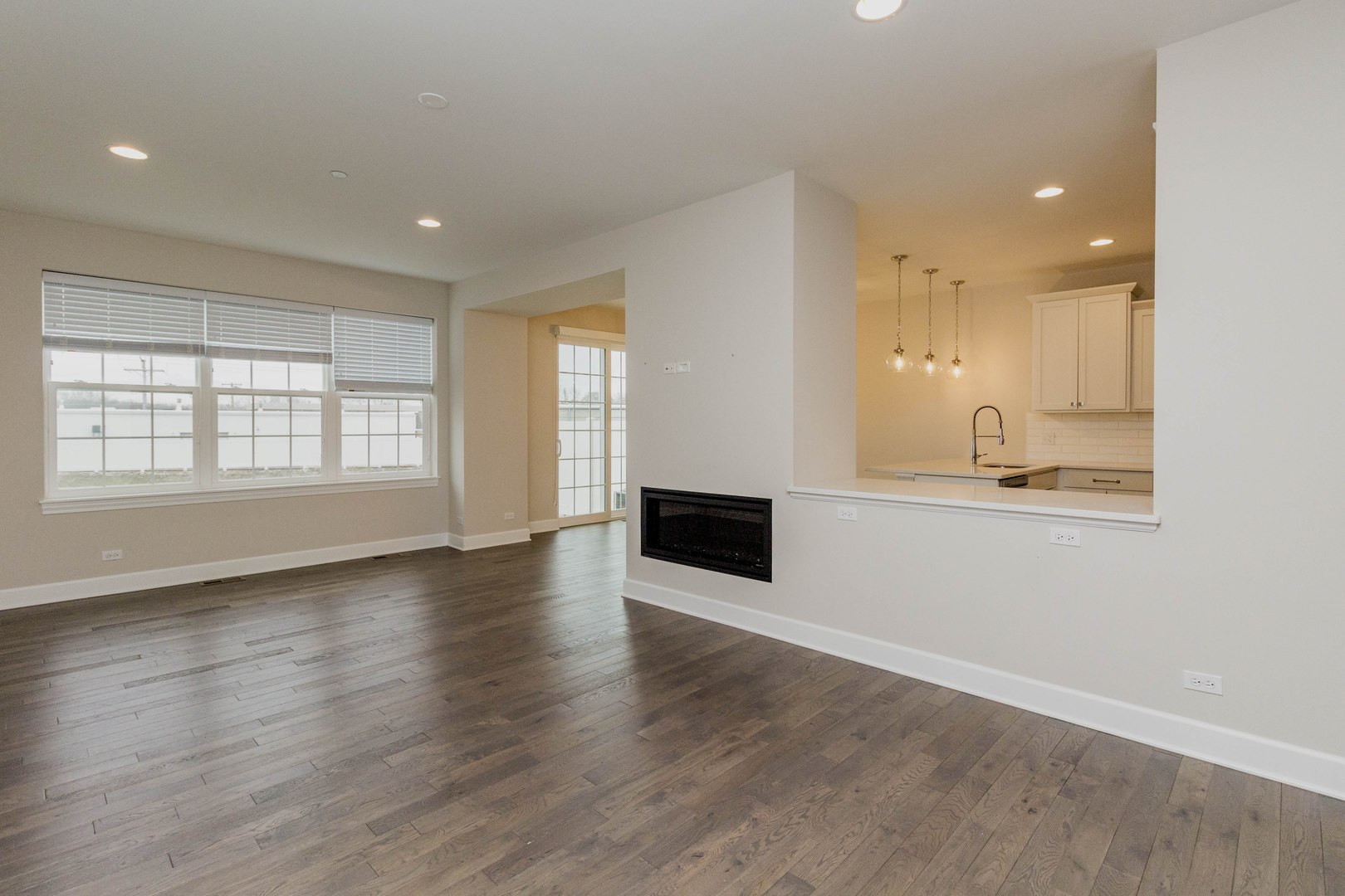 10723 Clock Tower Drive Countryside, IL 60525 - Photo 4 of 31 an empty room with wooden floor and windows