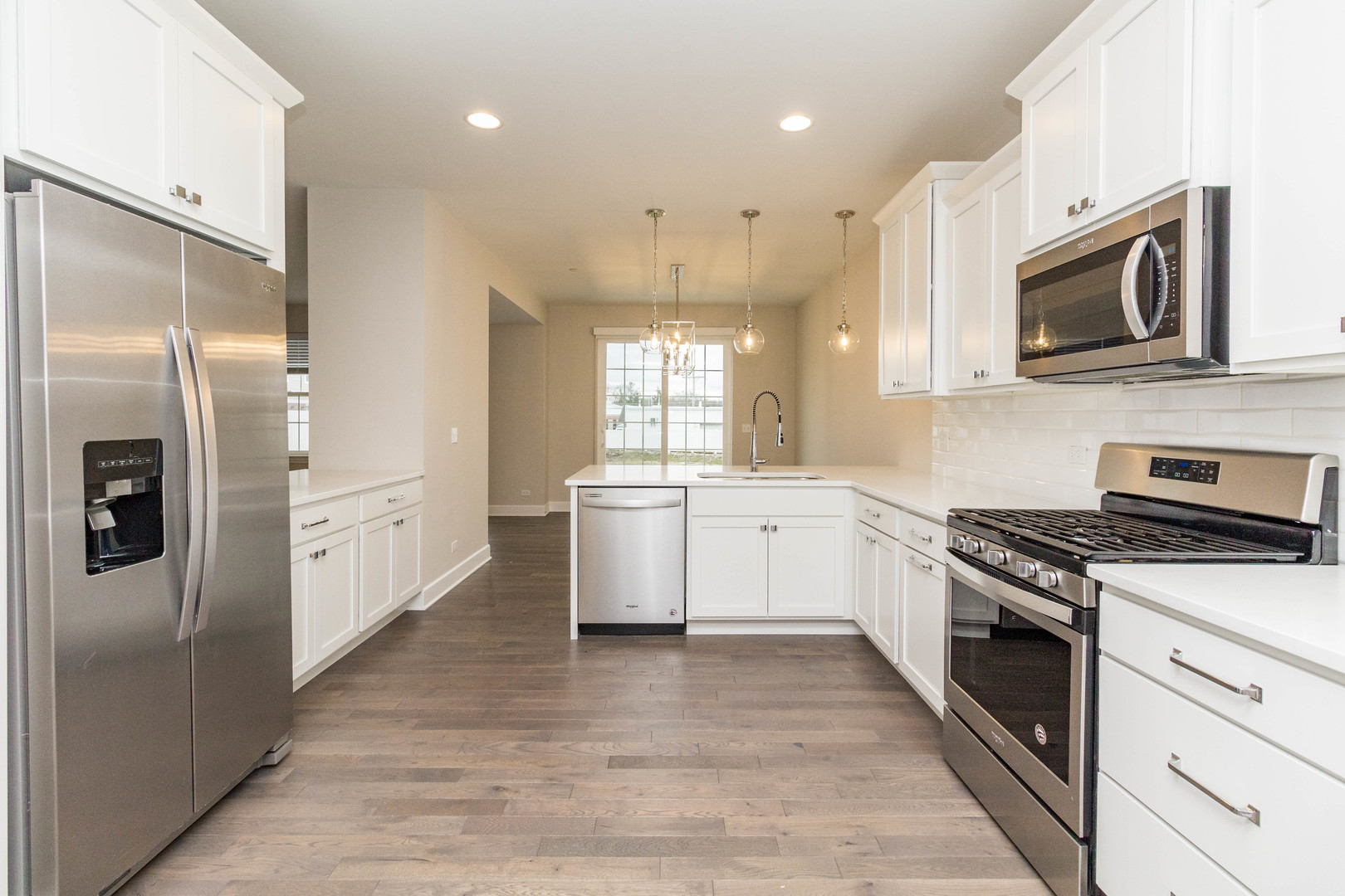 10723 Clock Tower Drive Countryside, IL 60525 - Photo 6 of 31 a kitchen with white cabinets and stainless steel appliances