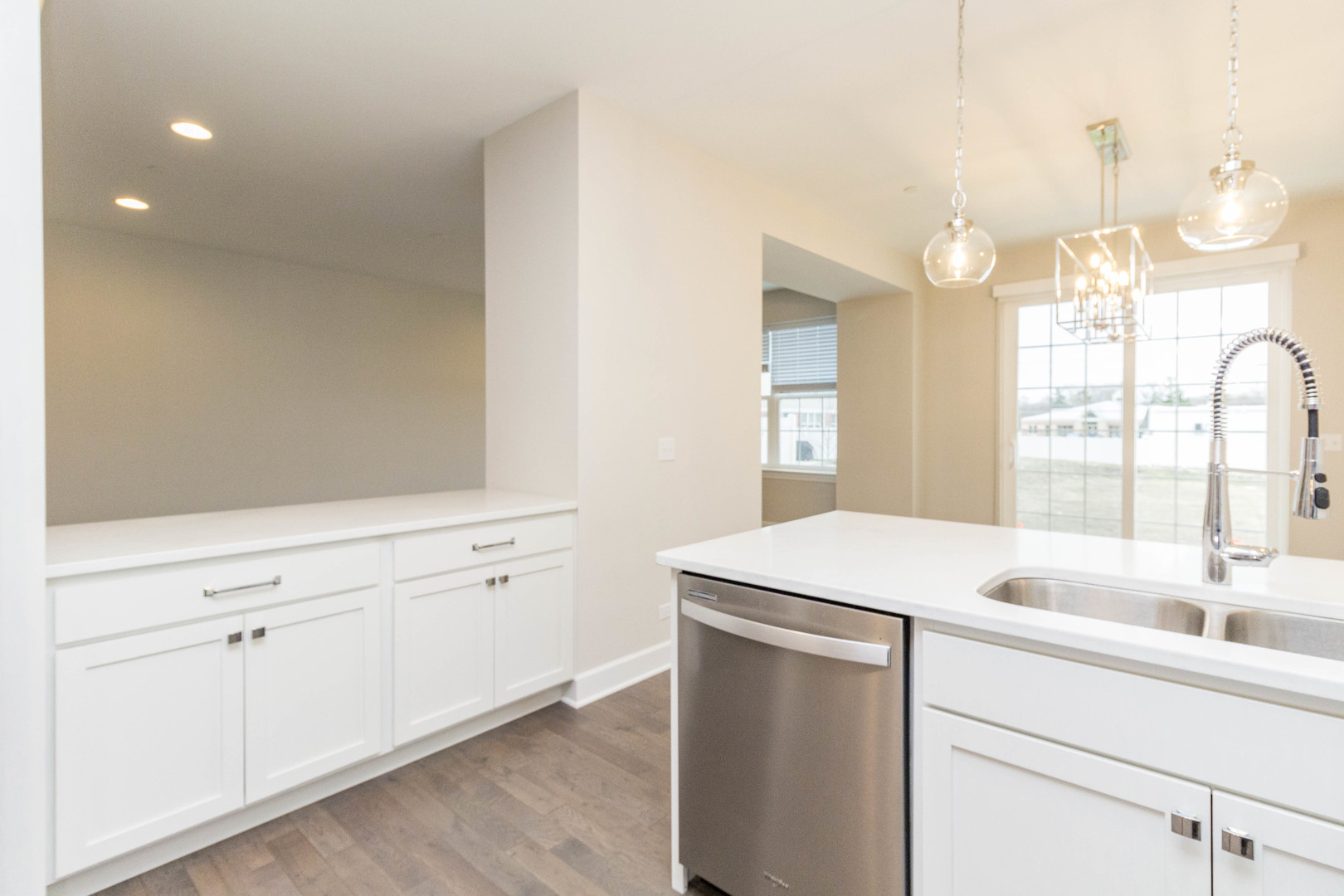 10723 Clock Tower Drive Countryside, IL 60525 - Photo 7 of 31 a room with a sink a chandelier and a mirror