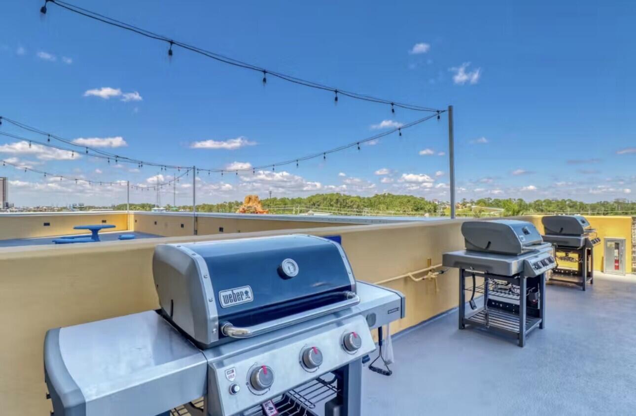 12011 Front Beach Road, Unit 103B Panama City Beach, FL 32407 - Photo 36 of 38 a view of a terrace with chairs and table