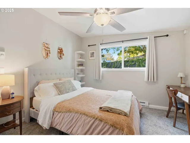 a bedroom with a bed and a table in it