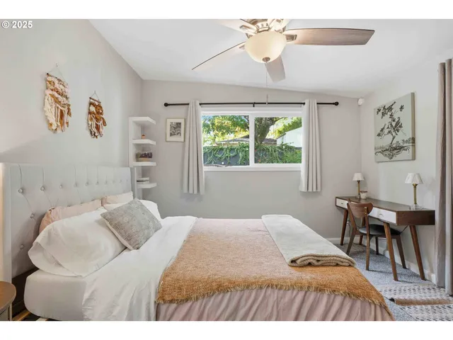 a bedroom with a bed and a table in it