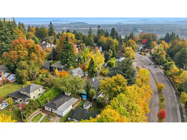 a view of a city with mountains in the background