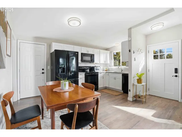 a dining room with furniture and window