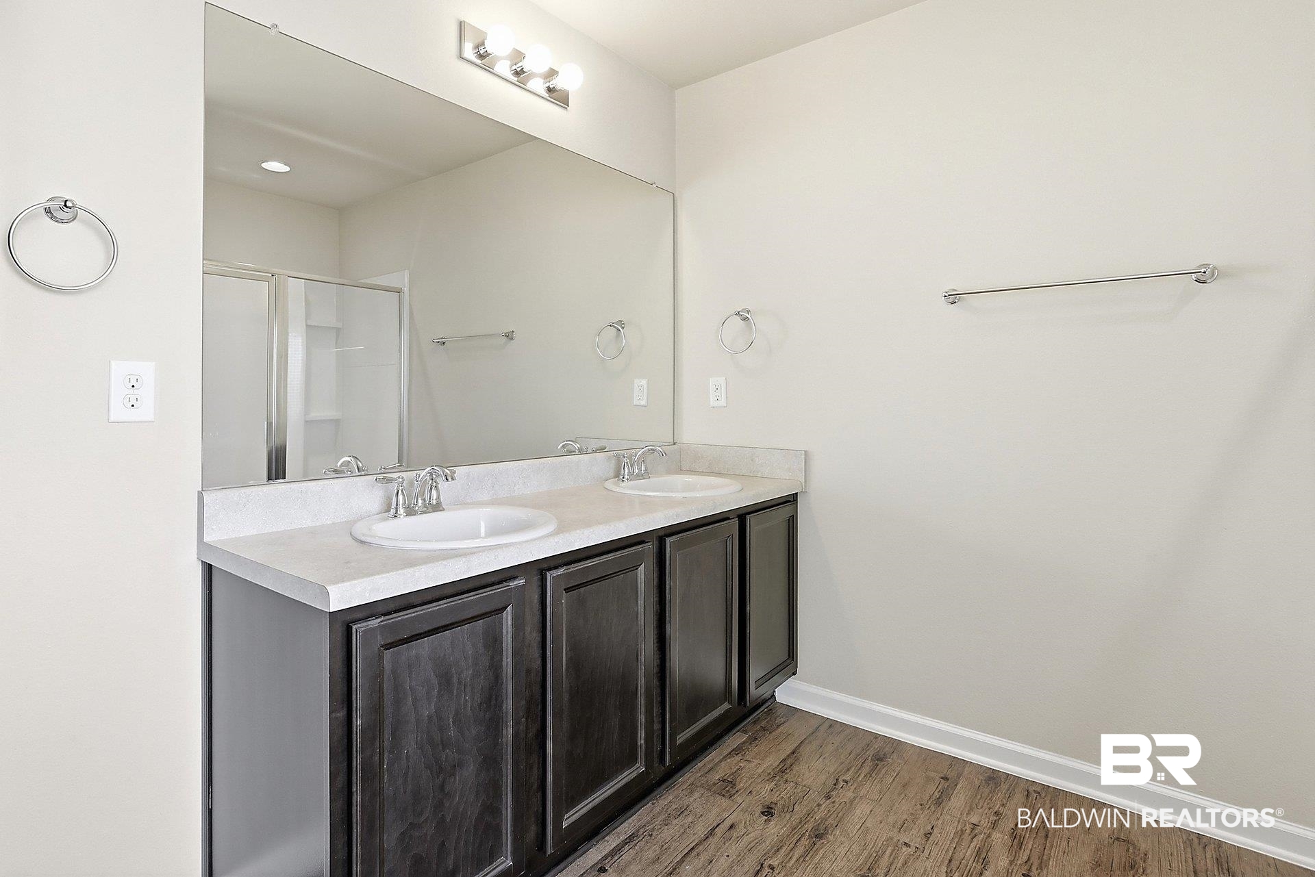 983 Summerton Drive Foley, AL 36535 - Photo 16 of 25 Bathroom with a shower stall, double vanity, and dark wood-style flooring