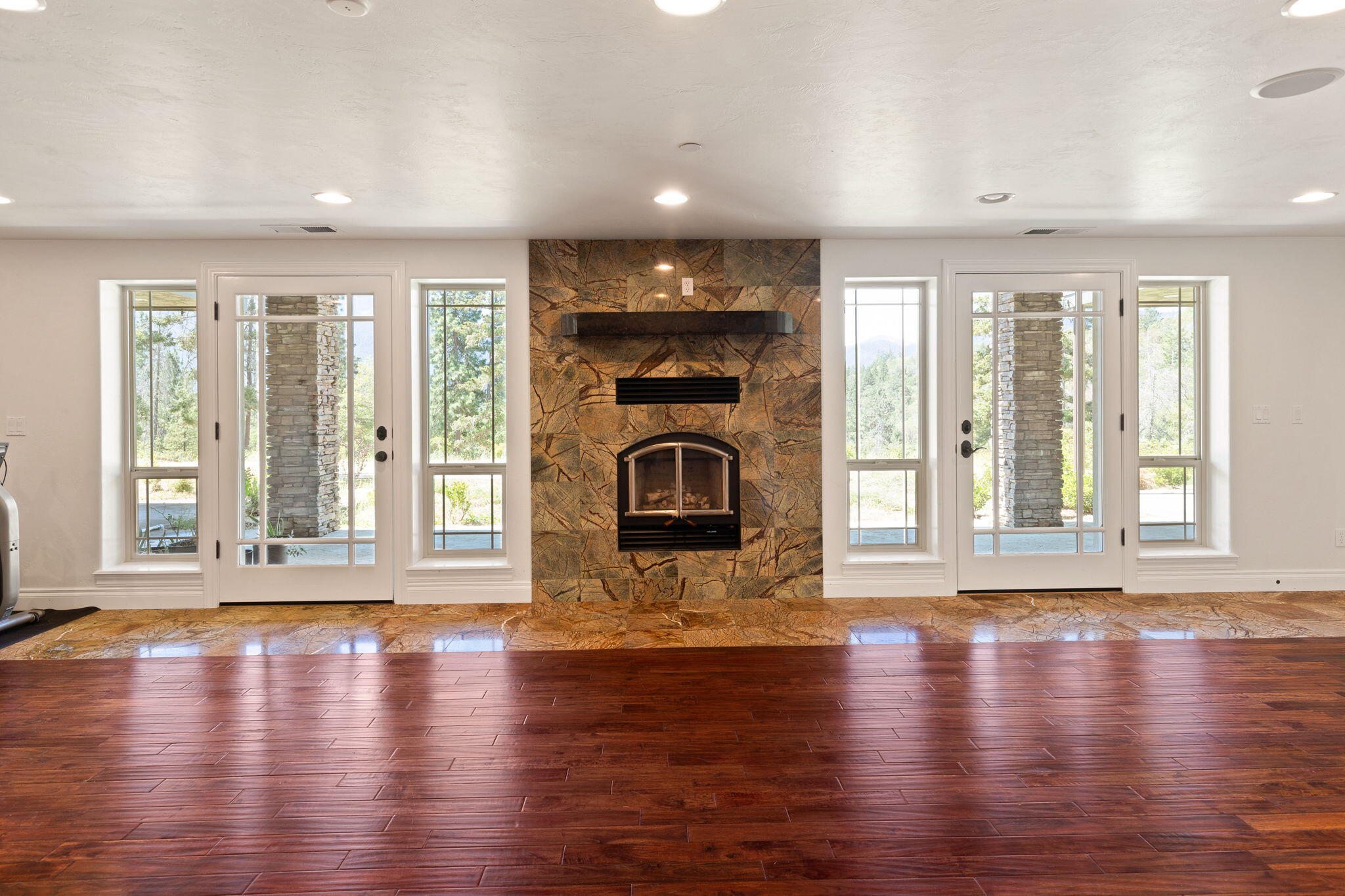 7304 North Applegate Road Grants Pass, OR 97527 - Photo 43 of 87 a view of an empty room with wooden floor and a window