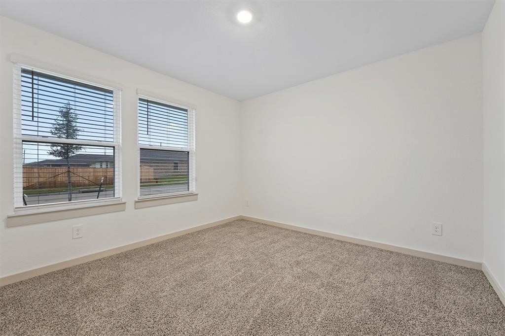 7815 Elm Birch Lane Rosharon, TX 77583 - Photo 13 of 19 an empty room with windows