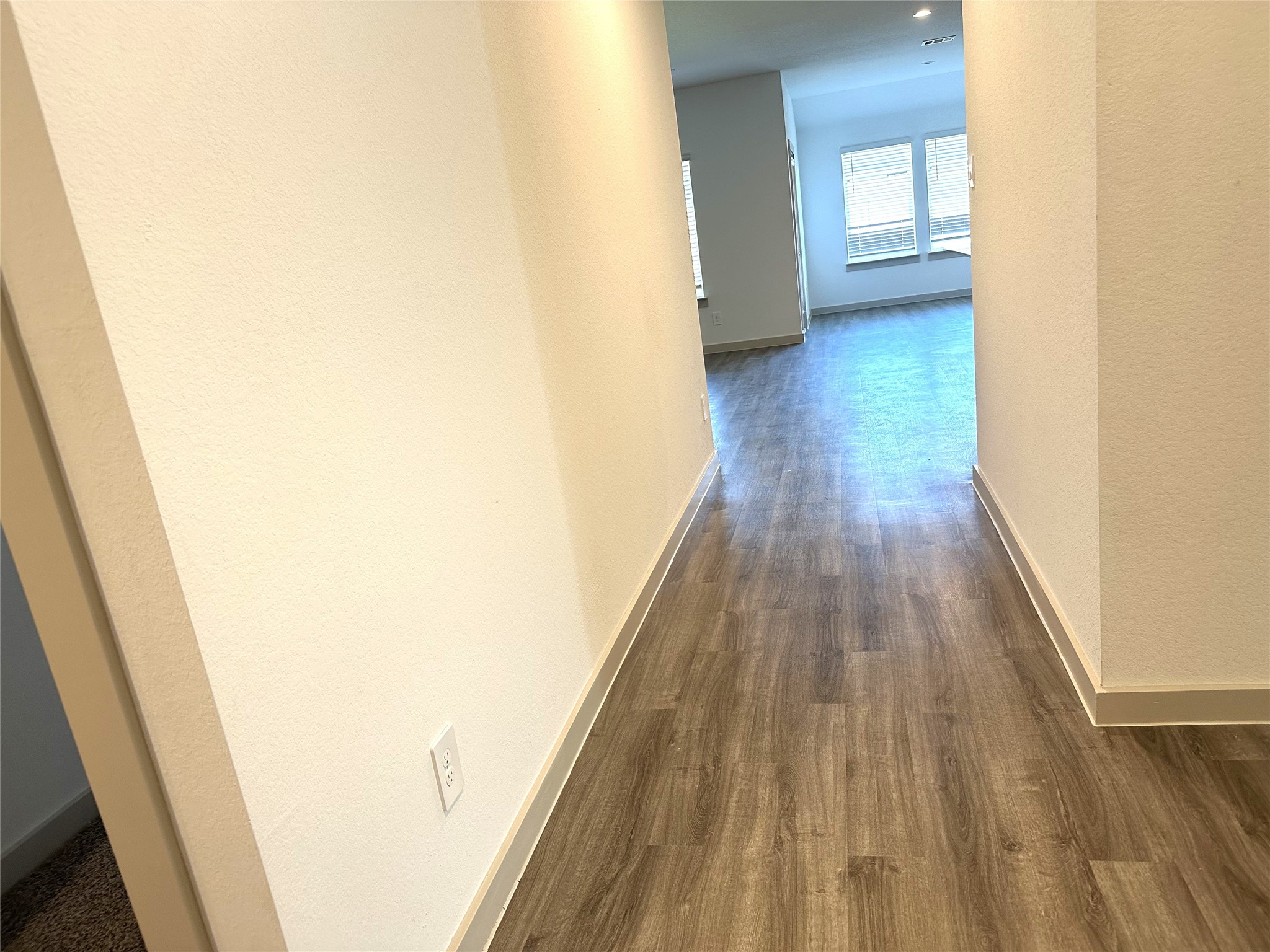 7815 Elm Birch Lane Rosharon, TX 77583 - Photo 3 of 19 a view of a hallway with wooden floor