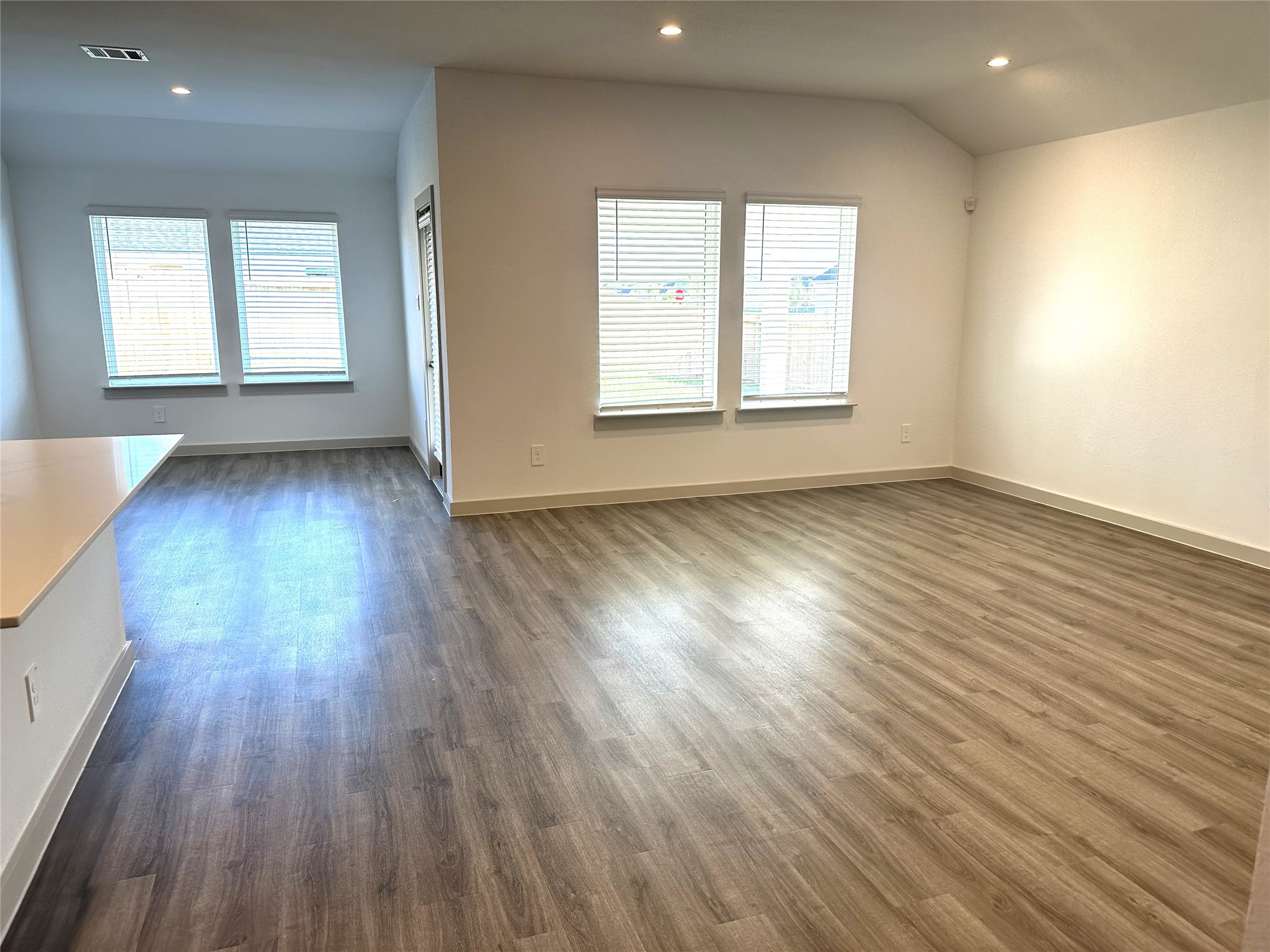 7815 Elm Birch Lane Rosharon, TX 77583 - Photo 4 of 19 an empty room with wooden floor and windows