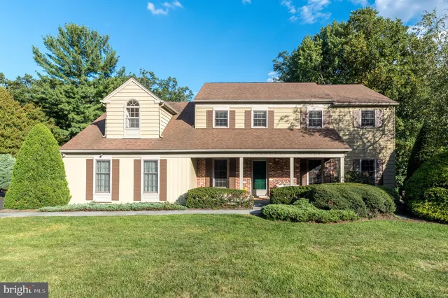 a aerial view of a house next to a yard