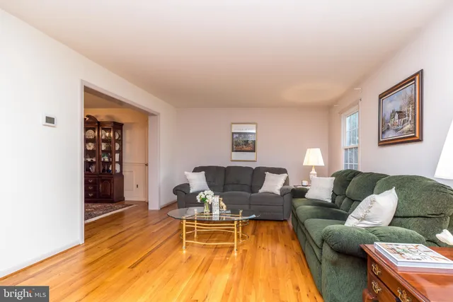 a kitchen with stainless steel appliances granite countertop a stove sink microwave and window