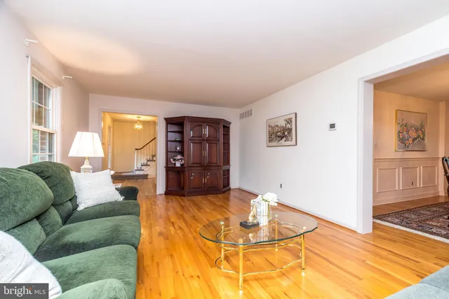 a dining room with furniture a window and kitchen view