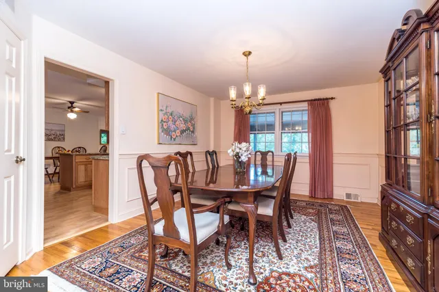 a workspace with furniture and a chandelier