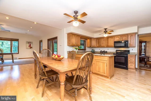 a view of a livingroom with wooden floor and a window