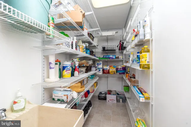 a bedroom with a bed and a wooden floor