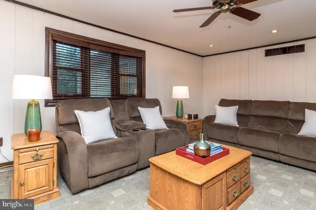 a view of an empty room with furniture