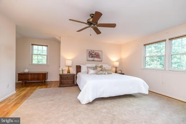 a aerial view of a house with swimming pool next to a yard