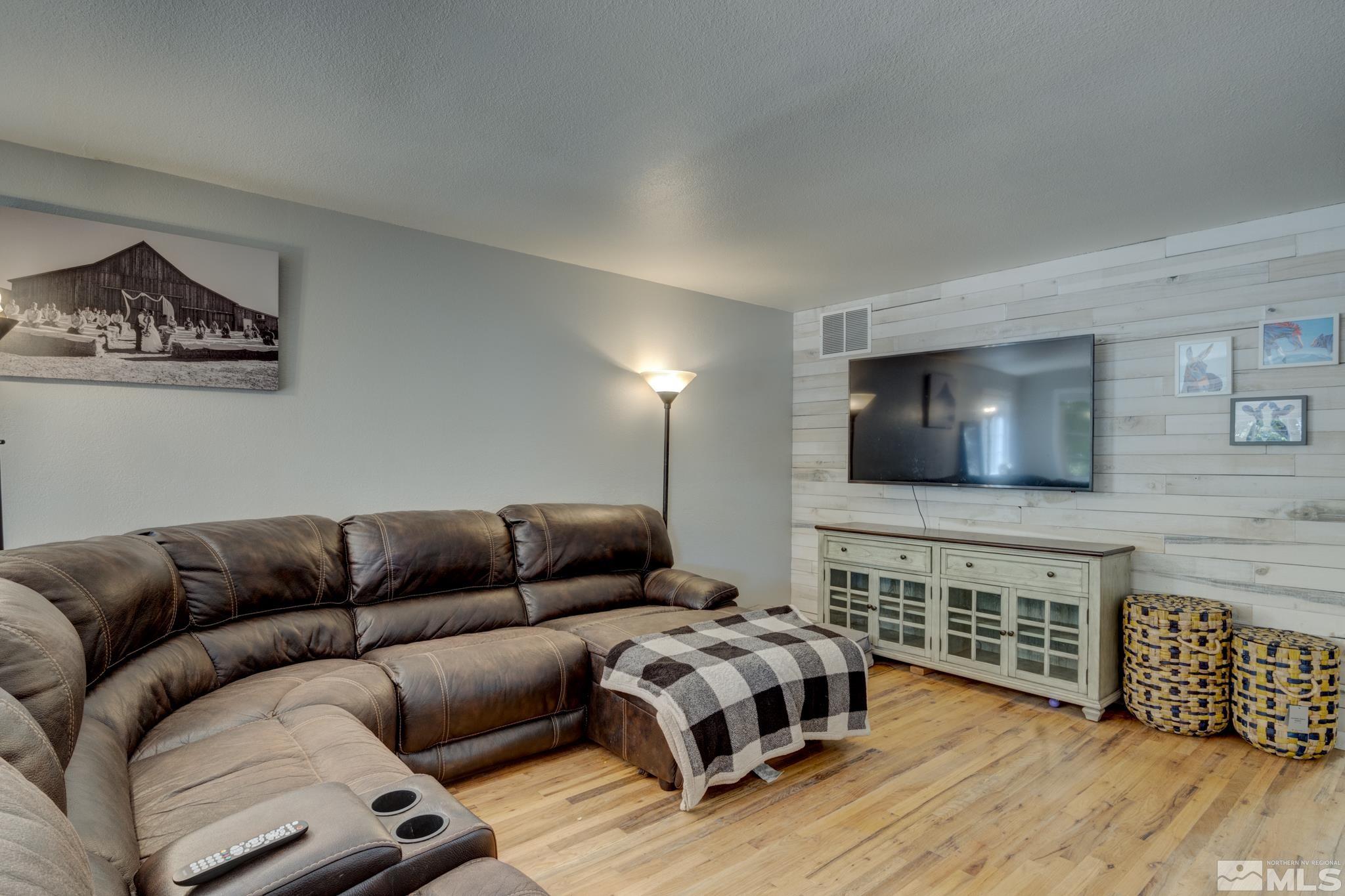3465 Dawn Circle Sparks, NV 89431 - Photo 6 of 29 a living room with furniture and a flat screen tv