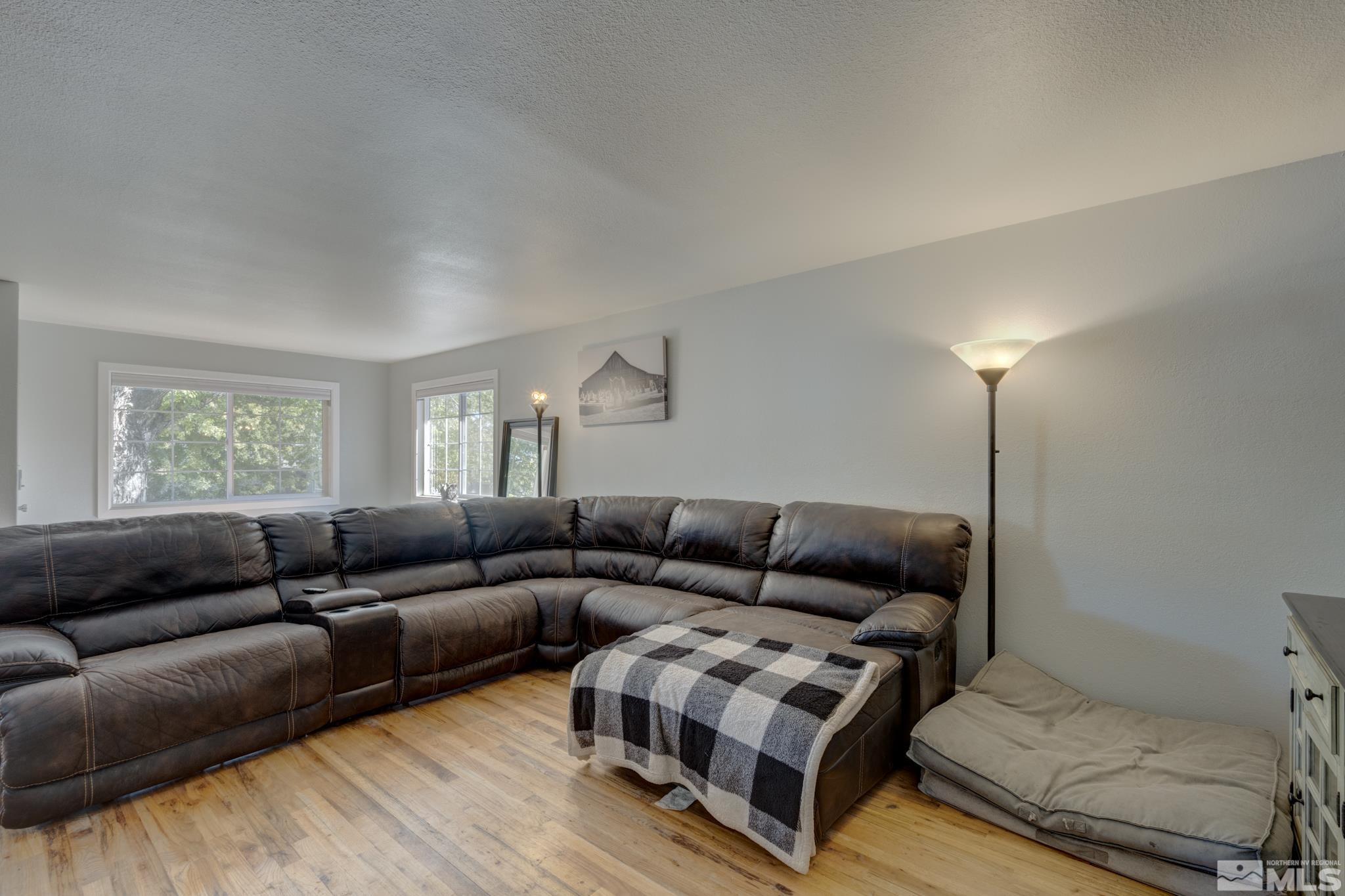 3465 Dawn Circle Sparks, NV 89431 - Photo 7 of 29 a living room with furniture a couch and a window