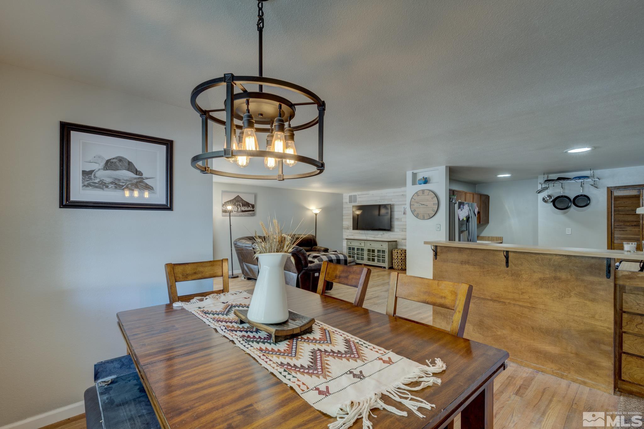 3465 Dawn Circle Sparks, NV 89431 - Photo 10 of 29 a living room with furniture a table and kitchen view