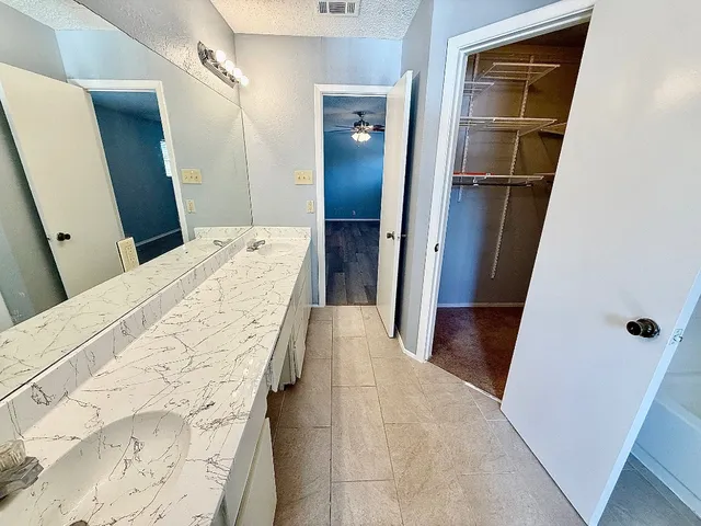 a bathroom with a tub and shower