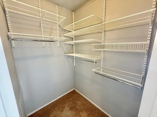 a view of a room with racks on the wall