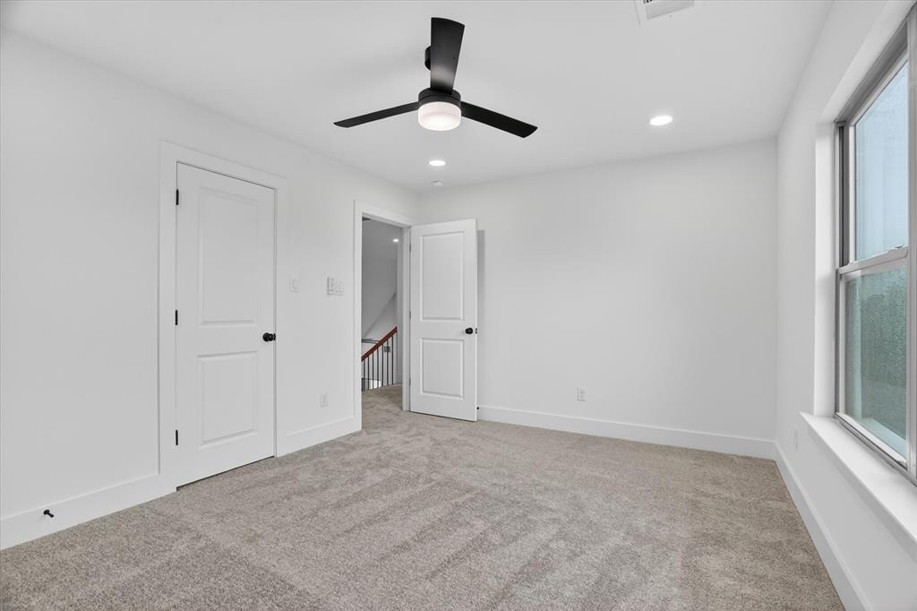 225 Kilkenny Road Poolville, TX 76487 - Photo 23 of 36 Neutral-toned carpeting complements white walls and trim