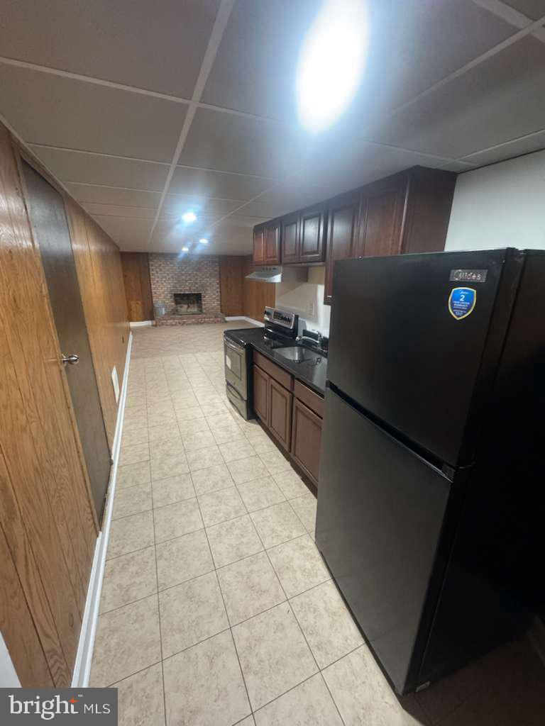 6112 Armor Drive Clinton, MD 20735 - Photo 12 of 15 a kitchen with stainless steel appliances granite countertop a refrigerator a stove and a sink