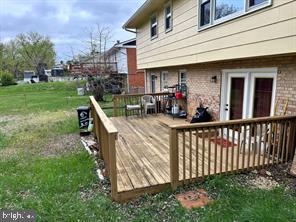 6112 Armor Drive Clinton, MD 20735 - Photo 15 of 15 a view of a house with backyard porch and sitting area