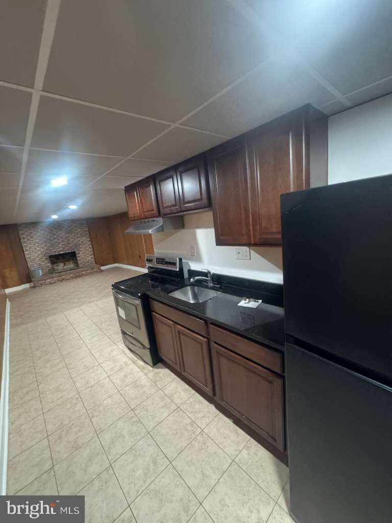 6112 Armor Drive Clinton, MD 20735 - Photo 4 of 15 a kitchen with granite countertop a sink cabinets and stainless steel appliances