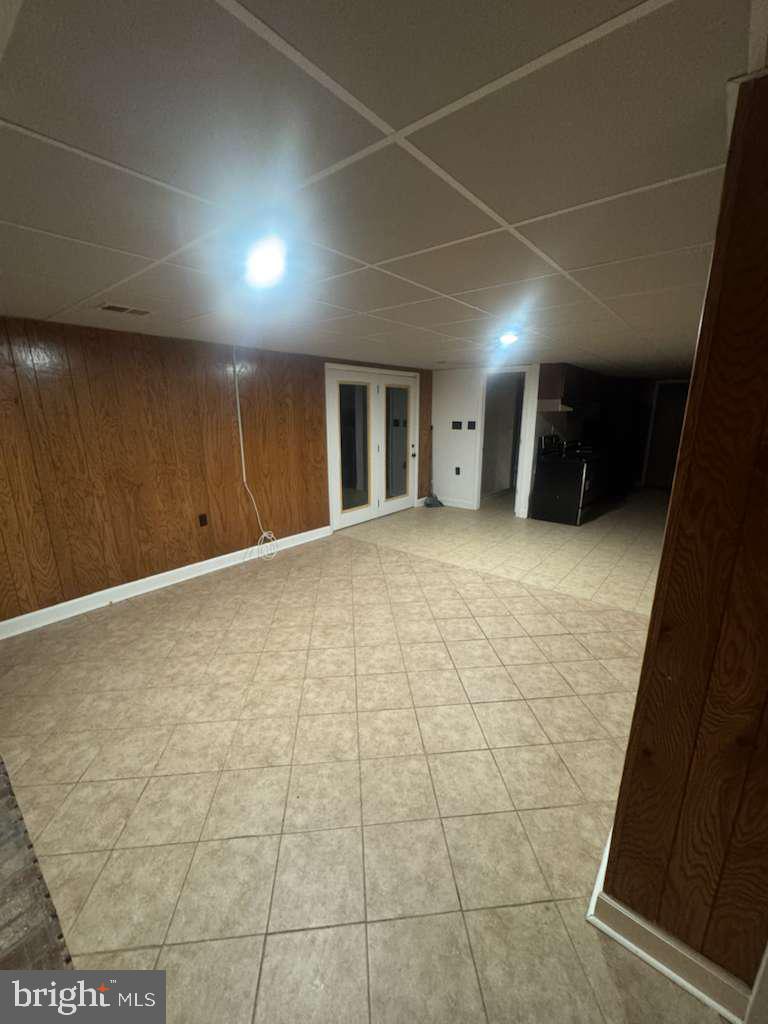 6112 Armor Drive Clinton, MD 20735 - Photo 5 of 15 a view of an empty room with wooden floor