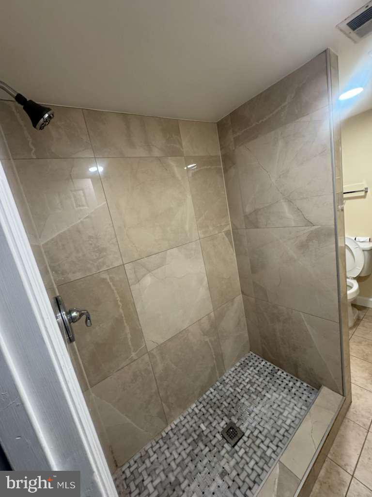 6112 Armor Drive Clinton, MD 20735 - Photo 10 of 15 a bathroom with a shower