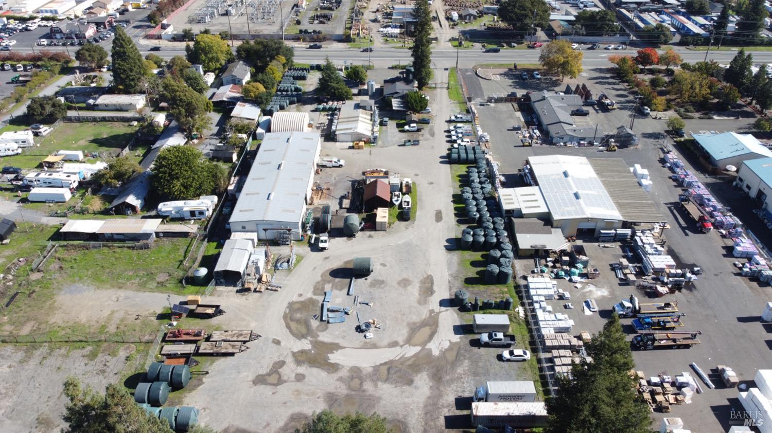 an aerial view of residential houses with outdoor space
